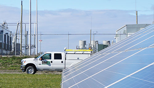BMEI truck parked at a solar farm during a solar panel installation project